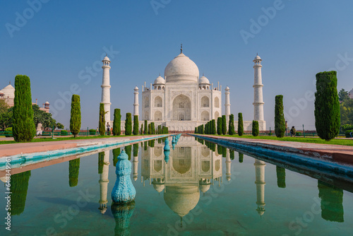 Architecture of the Taj Mahal as seen from the fountain. The Taj Mahal is an architectural masterpiece and one of the most iconic landmarks in the world.