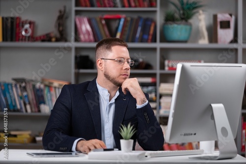 Man in dark office working on pc