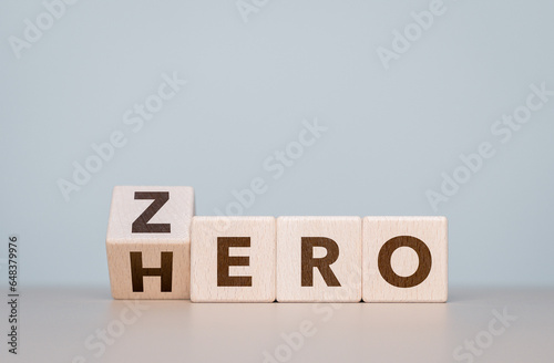Fototapeta Naklejka Na Ścianę i Meble -  ZERO to HERO word on the flip wooden cubes. Change for the better, personal skills improvement concepts. Career path advancement, job opportunities. Change differently for better or best directions.