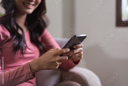 Women leisure on sofa and use smartphone to surfing social media and chatting in lifestyle at home