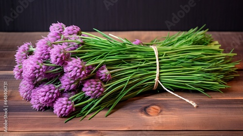 a thriving chive plant, with slender green stems and delicate purple blossoms, adding a mild onion-like flavor to cuisine