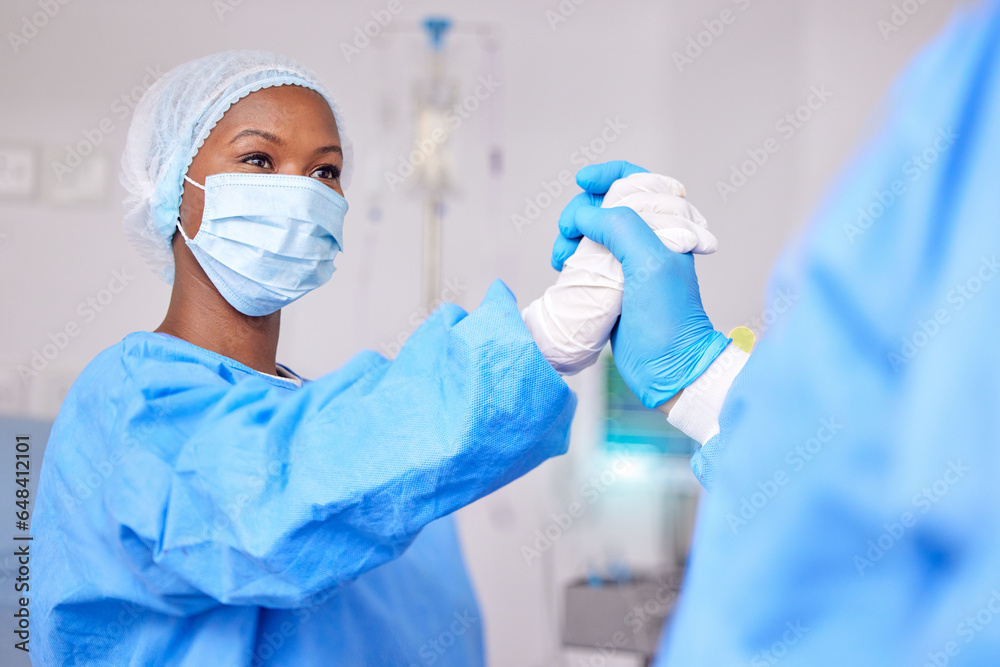 High five, teamwork and doctors in surgery with support, success and healthcare, operation theatre and face mask. Health, people and surgeon collaboration, hands together for trust and solidarity High five, teamwork and doctors in surgery with support, success and healthcare, operation theatre and face mask. Health, people and surgeon collaboration, hands together for trust and solidarity
