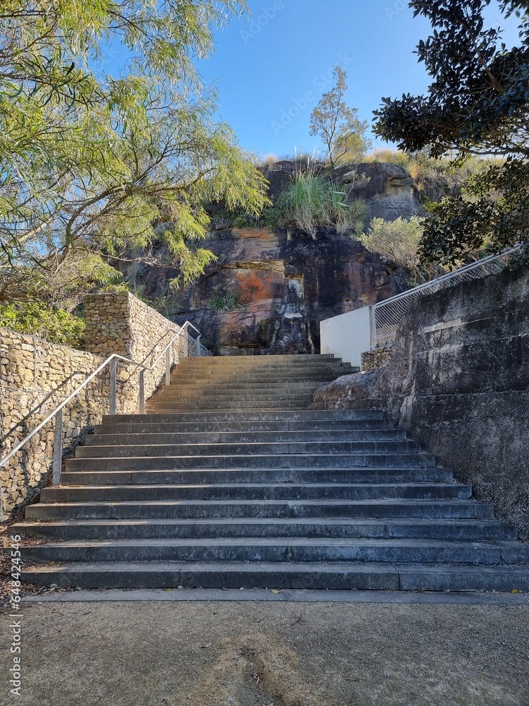 Stone steps going up at Carradah Park Sydney Australia. The park is a rehabilitated oil refinery and storage site.