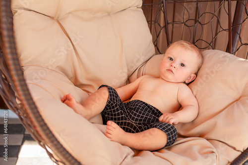 Go to Page
|12345Next
a little boy is lying on a light hanging outdoor chair photo