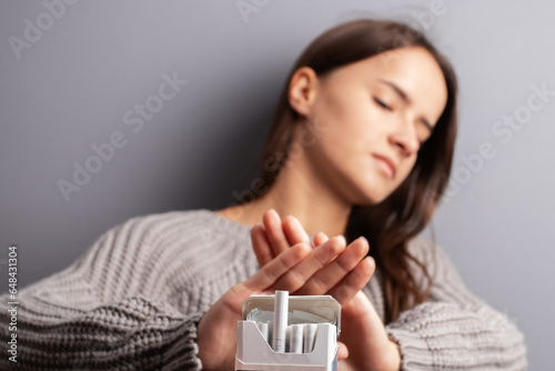 Papier peint reject cigarette,stop smoking, teenager girl shows a sign of refusal of tobacco