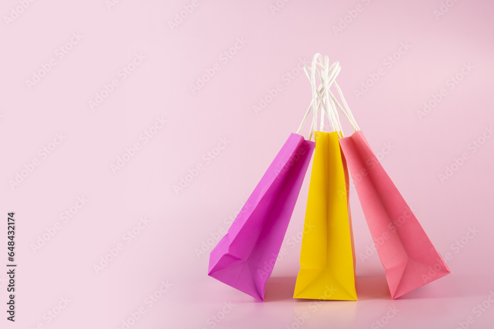 online supermarket, shopping bags on pink background, shop package