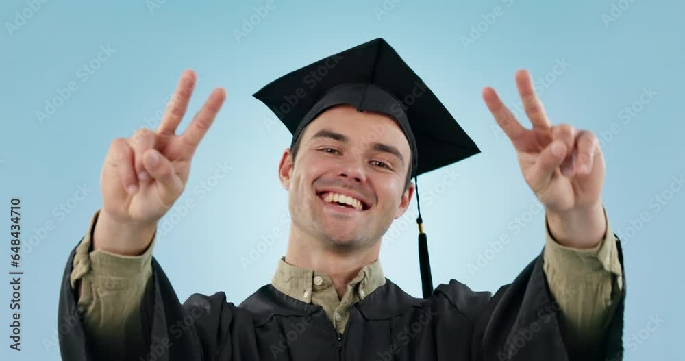 Graduation, man and peace sign at studio, smile and face for ...