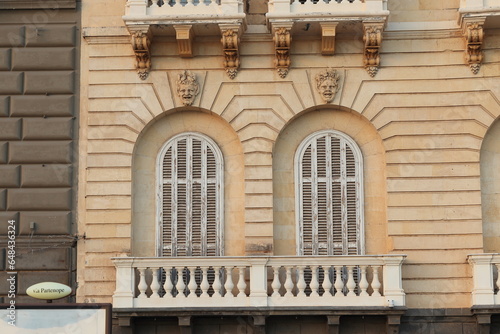 Naples Via Partenope Building Facade with Decorated Windows, Balcony and Street Sign Close Up, Italy photo