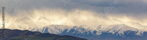 Panoramic view of Ala Archa mountains with raining clouds, Kyrgyzstan