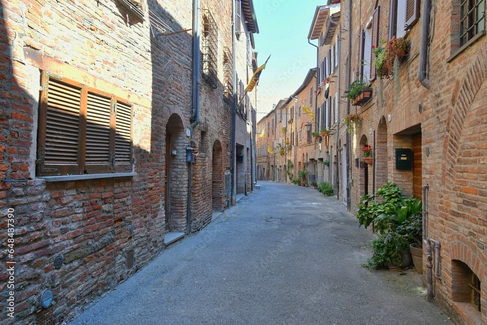 A street between the houses of Città della Pieve, a medieval village in Umbria, Italy.