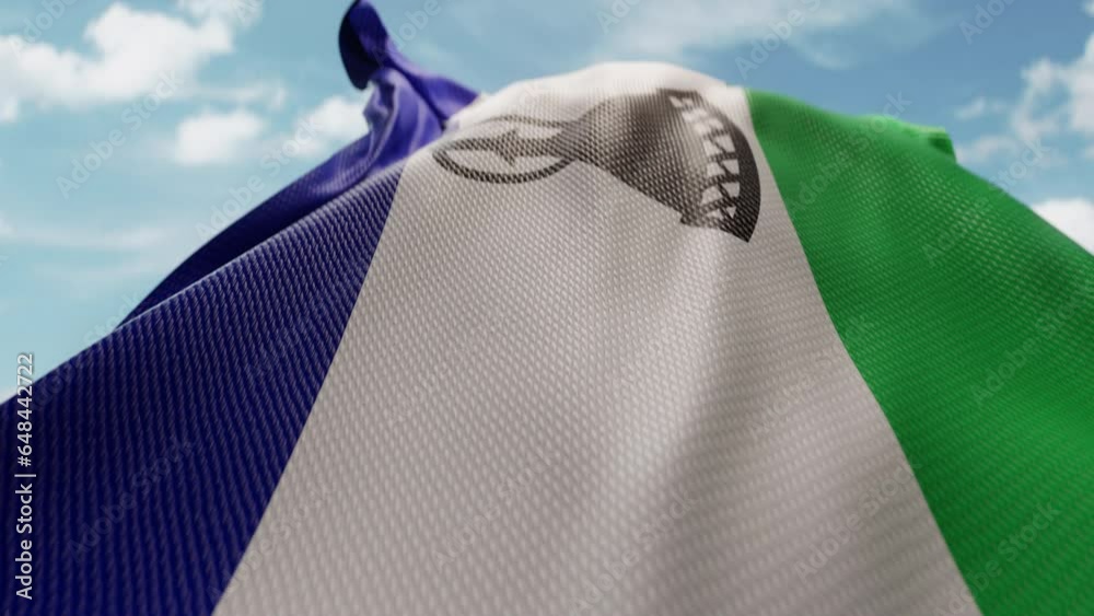 Wavy flag of Lesotho blowing in the wind in slow motion. Waving ...