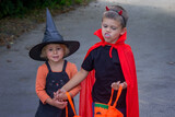 Children dressed in costumes for Halloween, festive night. Selective focus