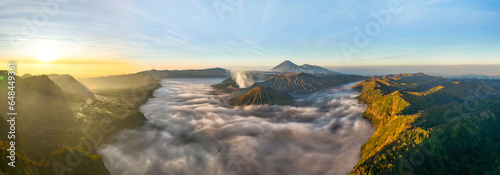 Aerial view panorama of Amazing Mount Bromo volcano during sunrise from king kong viewpoint on Mountain Penanjakan in Bromo Tengger Semeru National Park,East Java,Indonesia.Nature landscape background photo