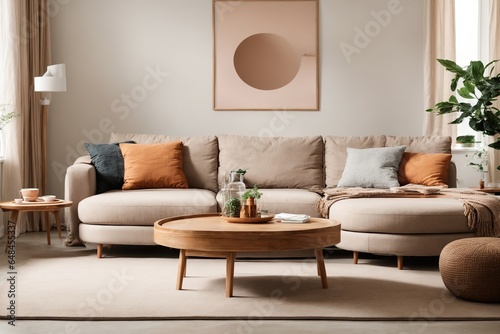 In a modern living room  a beige sofa set is centered around a sleek round wooden coffee table that is placed in front of a white wall with eye-catching posters