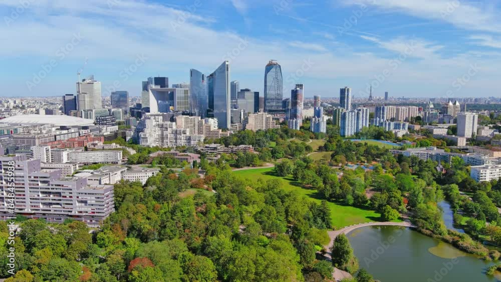 Paris: Aerial view of skyscraper skyline of La Defense, major business district in capital city of France from Parc André Malraux park, sunny day with blue sky—landscape panorama of Europe from above