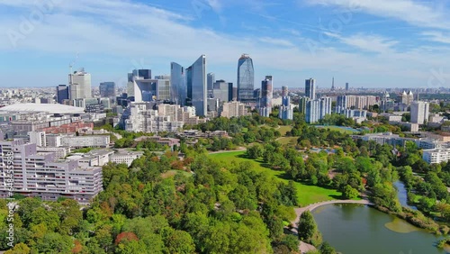 Paris: Aerial view of skyscraper skyline of La Defense, major business district in capital city of France from Parc André Malraux park, sunny day with blue sky—landscape panorama of Europe from above photo
