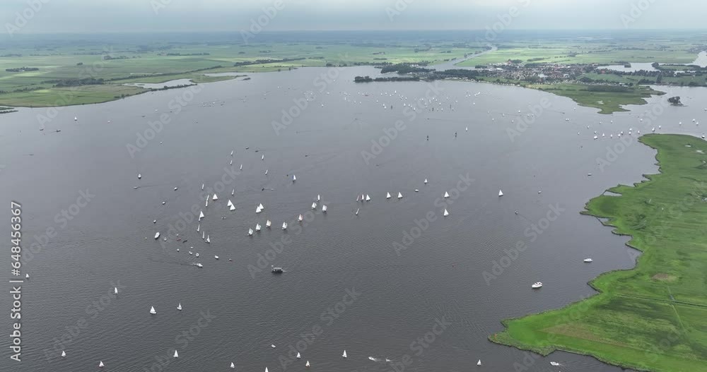 Aerial drone view of sailing boats, leisure activity in Friesland, The Netherlands. Aerial drone view of sailing boats, leisure activity in Friesland, The Netherlands.