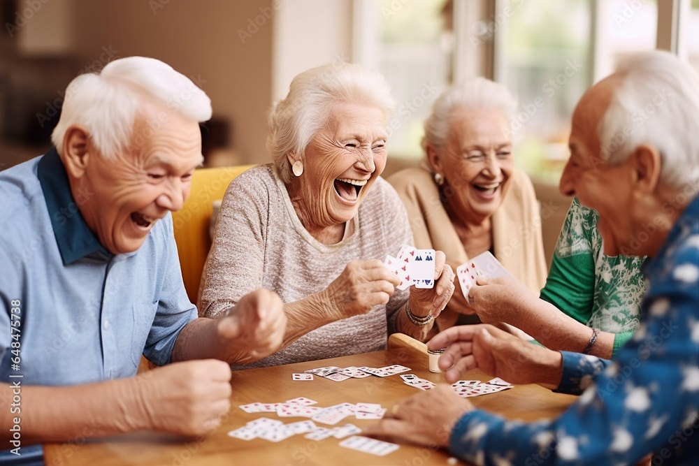 A joyful group of seniors gathers in a retirement nursing home, playing cards and sharing hearty laughter, fostering camaraderie and creating a warm and lively atmosphere in the community living space - obrazy, fototapety, plakaty 