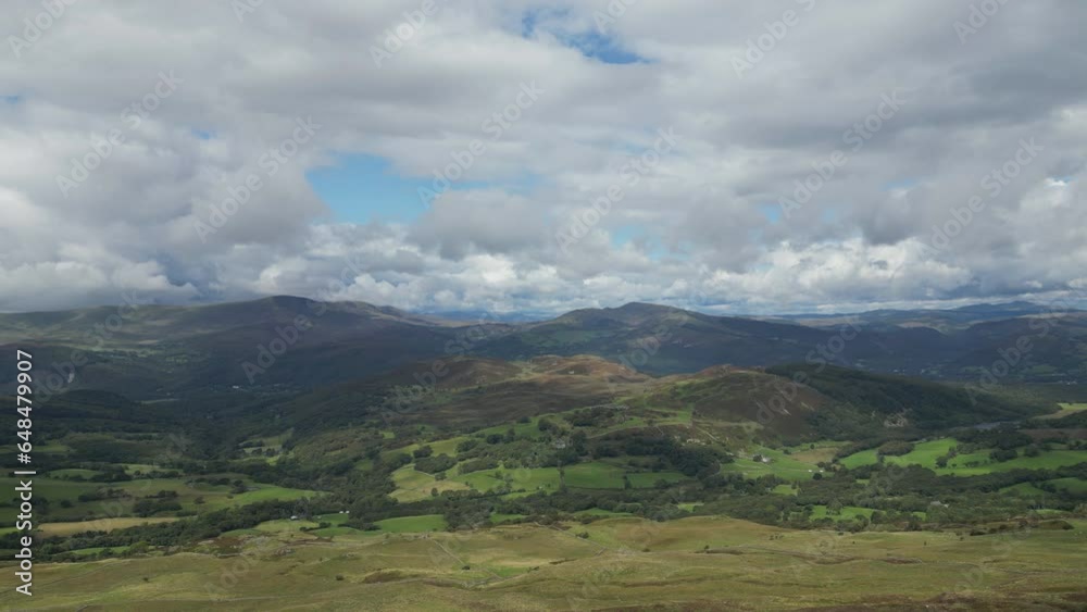 A drone ascending over beatific scenery with the Welsh moorland and mountains. A drone ascending over beatific scenery with the Welsh moorland and mountains.