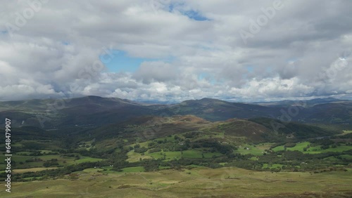 A drone ascending over beatific scenery with the Welsh moorland and mountains.