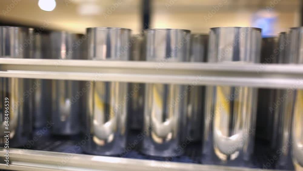 Conveyor line with the production of aluminum cans. Production of aluminum cans for drinks. Plant of high-tech equipment for the food industry. Conveyor line with the production of aluminum cans. Production of aluminum cans for drinks. Plant of high-tech equipment for the food industry.