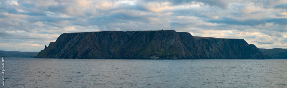 Midnight sun over the Nordkapp (North Cape), view froma ship, Troms of Finnmark, Norway. commonly referred to as the northernmost point of Europe Midnight sun over the Nordkapp (North Cape), view froma ship, Troms of Finnmark, Norway. commonly referred to as the northernmost point of Europe