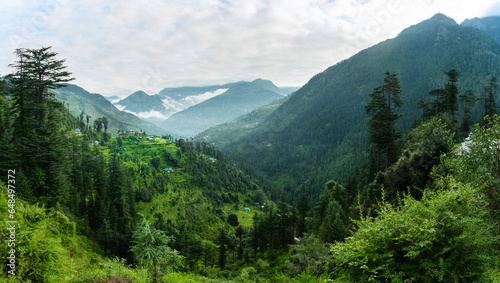 Tableau sur toile Aerial landscape of the mountain village of Jibhi surrounded by greenery and cedar forest, Jibhi, Himachal Pradesh, India
