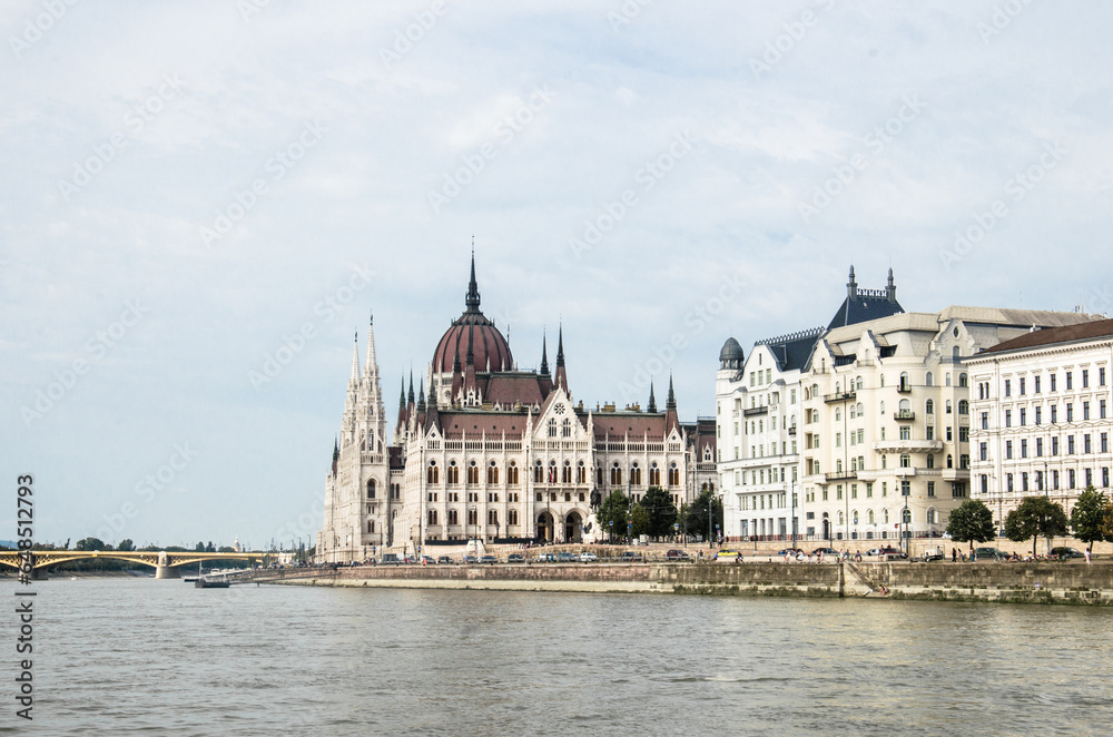 Panorama of Budapest Parliament and ancient Hungarian buildings from Danube River stock photo.