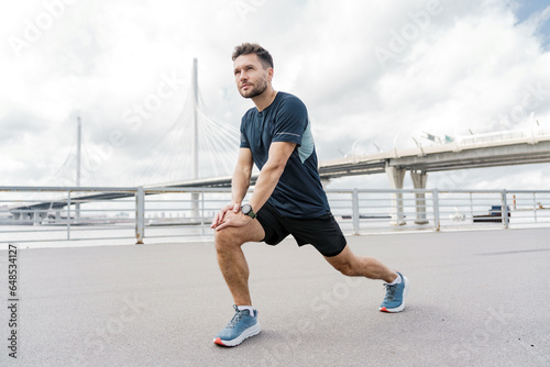 Man smiles exercise fitness for health.  Psychological therapy.Warm-up man confident interval training. A happy athlete jogging in sportswear. © muse studio