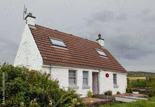 Small scottish croft with a bridge at the front door