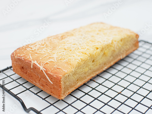 cassava tapai cake with cheese topping, indonesian food photo