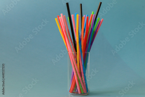 Different coloured straws with different patterns photographed on background isolated.