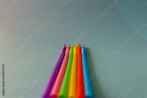 Different coloured straws with different patterns photographed on background isolated.