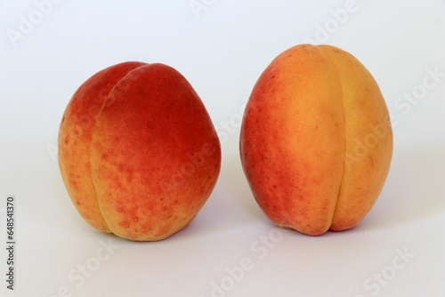 Apricots. Apricot isolate. Apricots with slice on white. Full depth of field.
