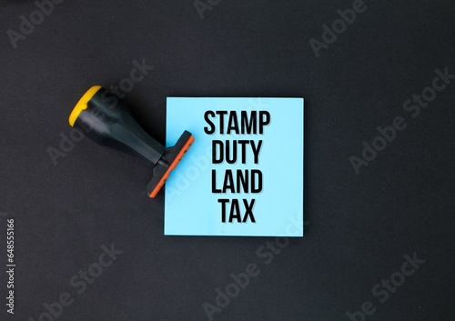 stamp and colored paper with the words Stamp Duty Land Tax or the letters SDLT