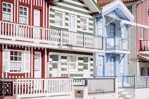 View of a row of colorful houses in Costa Nova, a picturesque beach village near Aveiro, Portugal