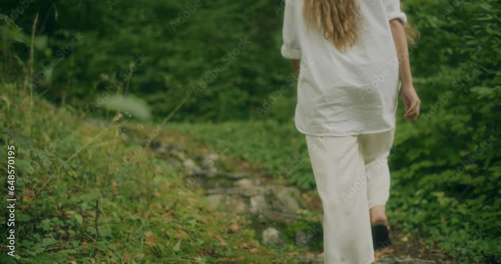 Woman Moving Up On Stairs By Plants In Forest Woman Moving Up On Stairs By Plants In Forest