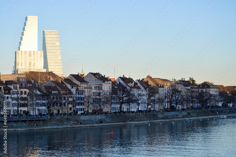 the roche towers in basel with houses along the rhine
