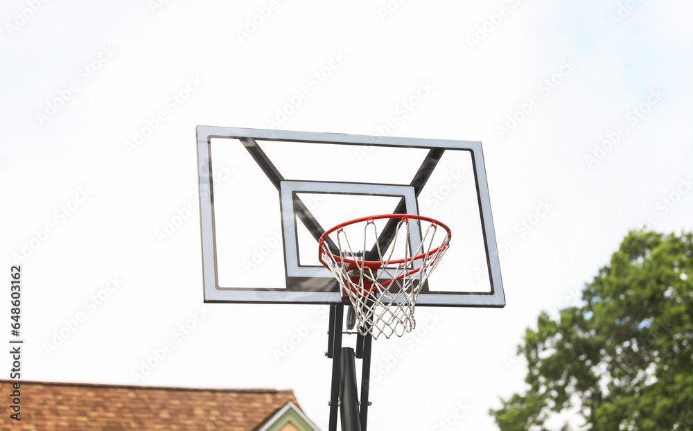 basketball hoop against a clear blue sky, inviting endless play and representing sportsmanship, ambition, and teamwork