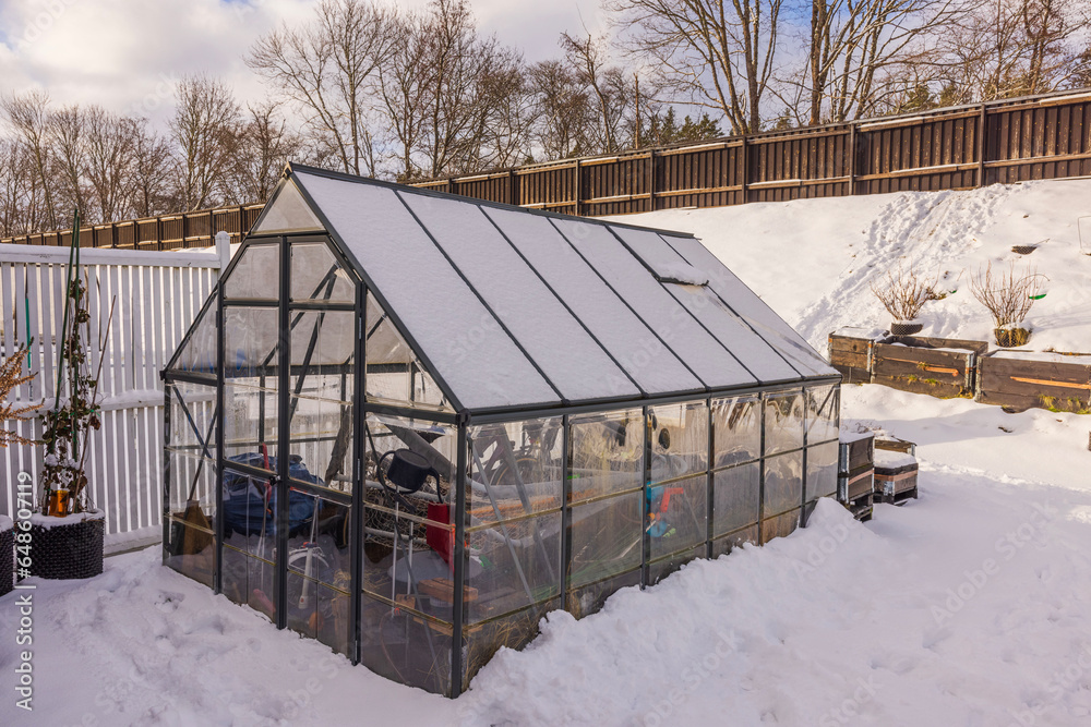 Beautiful winter view of small garden and greenhouse. Gardening concept. Sweden. Beautiful winter view of small garden and greenhouse. Gardening concept. Sweden.