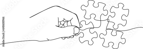continuous single line drawing of hand holding jigsaw puzzle piece, line art vector illustration