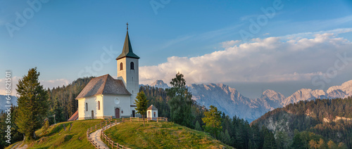 Panoramic view of Sveti Duh (St. Spirit) church under mountain Olseva in Kamnik-Savinja Alps, Slovenia