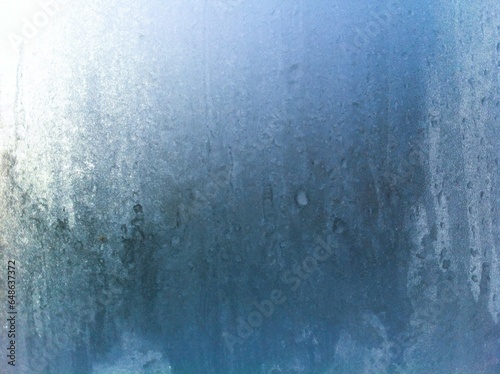 Frost on the window pane. Frosty pattern.