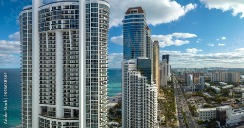 View from above of luxurious highrise hotels and condos on Atlantic ocean shore in Sunny Isles Beach city. American tourism infrastructure in southern Florida