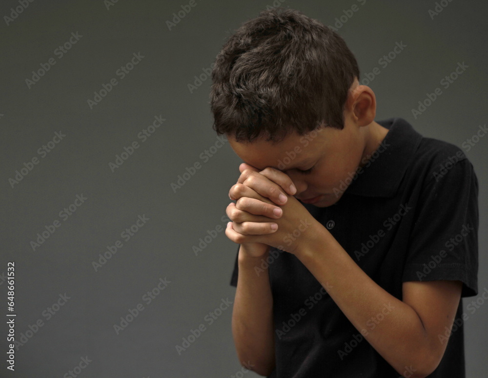 boy praying to God with hands held together with closed eyes with people stock image stock photo boy praying to God with hands held together with closed eyes with people stock image stock photo