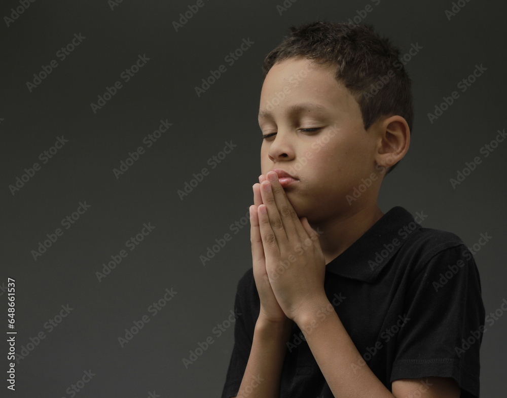 boy praying to God with hands held together with closed eyes with people stock image stock photo boy praying to God with hands held together with closed eyes with people stock image stock photo