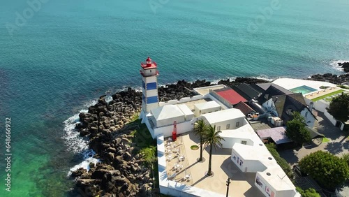 Drone fottage of the lighthouse in port of Cascais in Portugal, Spring 2023 photo