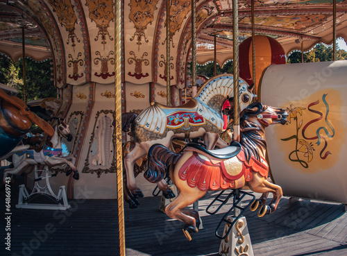 Fototapeta Naklejka Na Ścianę i Meble -  Vintage fair horse carousel in amusement park concept photo