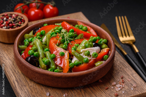 Delicious fresh salad of green beans, peas, sweet peppers and cheese