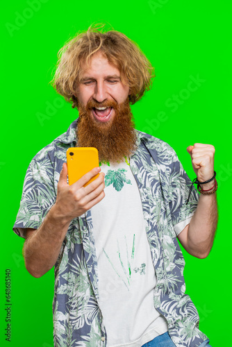 Happy excited man guy use smartphone typing browsing shouting say wow yes found out great big win good news lottery goal achievemen celebrating success, winning play game on chroma key background